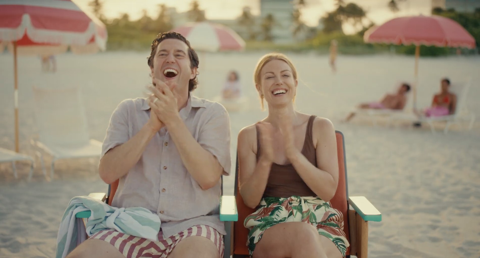 Sarah Pribis and Ben Burnett as a beachside couple